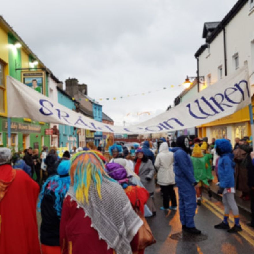 sraid eoin wren in colourful clothes and masks on strand st. dingle peninsula ireland