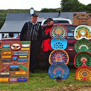 Two men at Camp Rally Dingle with colourful tractor seats