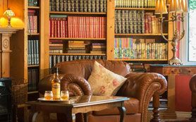 books and leather chair library bar Benners hotel dingle peninsula
